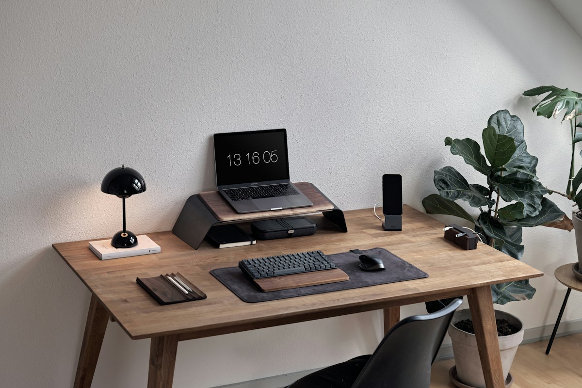 Laptop and notebook on a desk — illustrative photograph